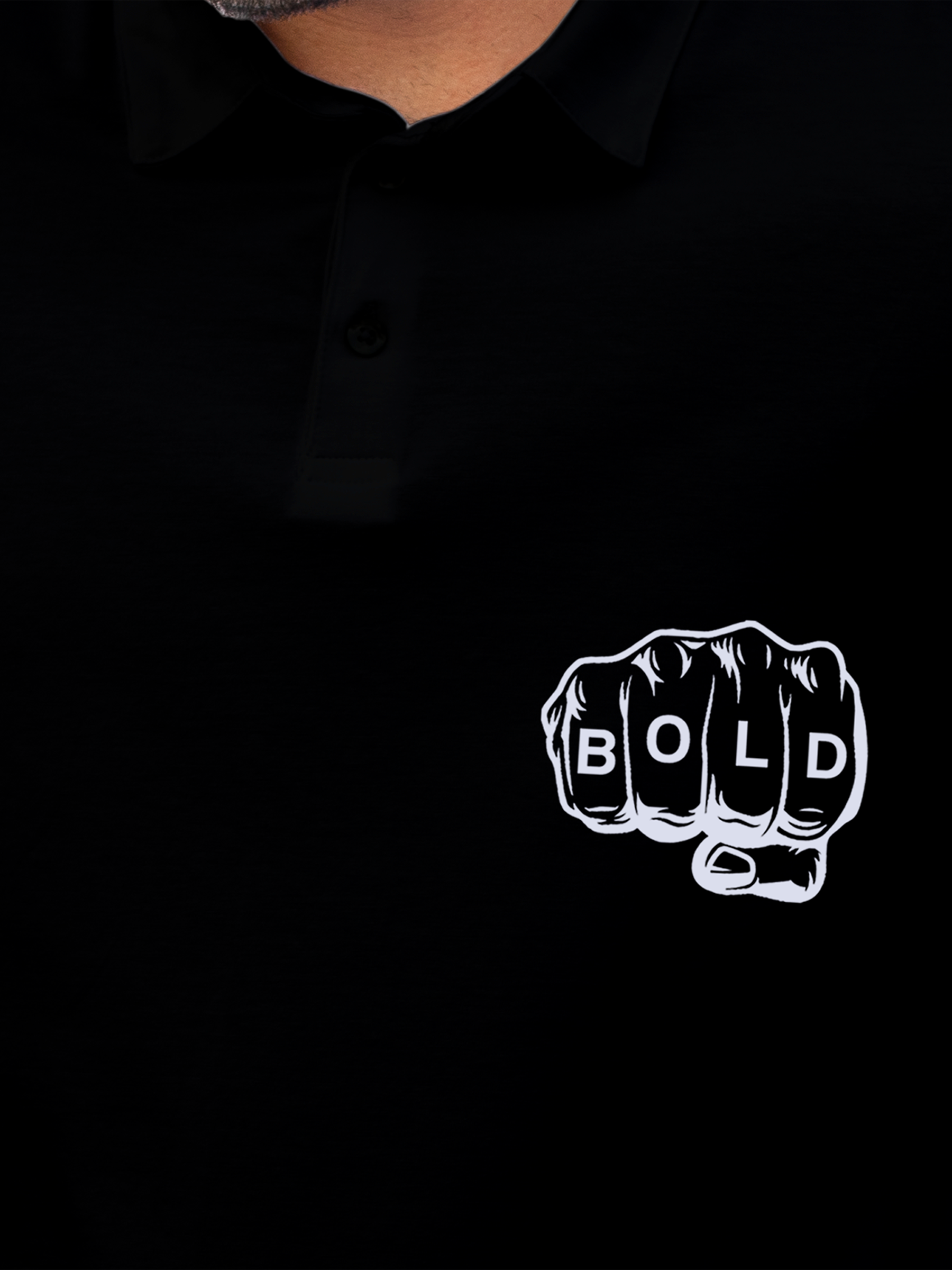 Close up of 'Bold' design on Men's Black Polo T-shirt, highlighting intricate details and vibrant print.
