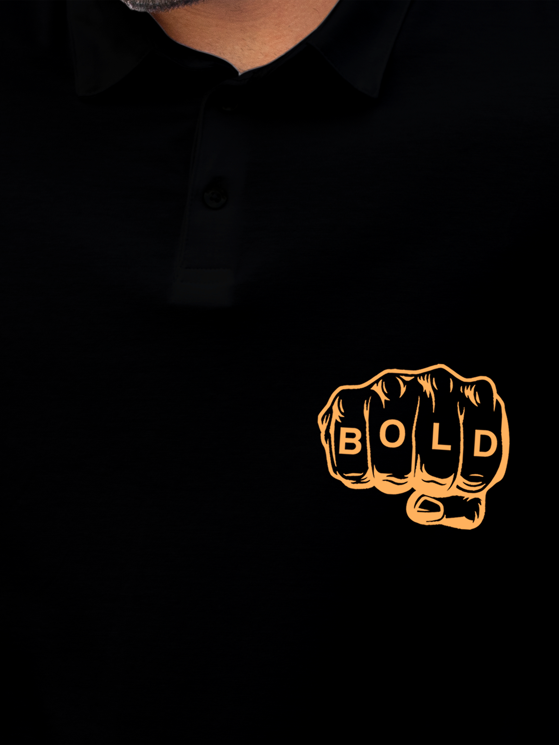 Close up of 'Bold' design on Men's Black Polo T-shirt, highlighting intricate details and vibrant print.