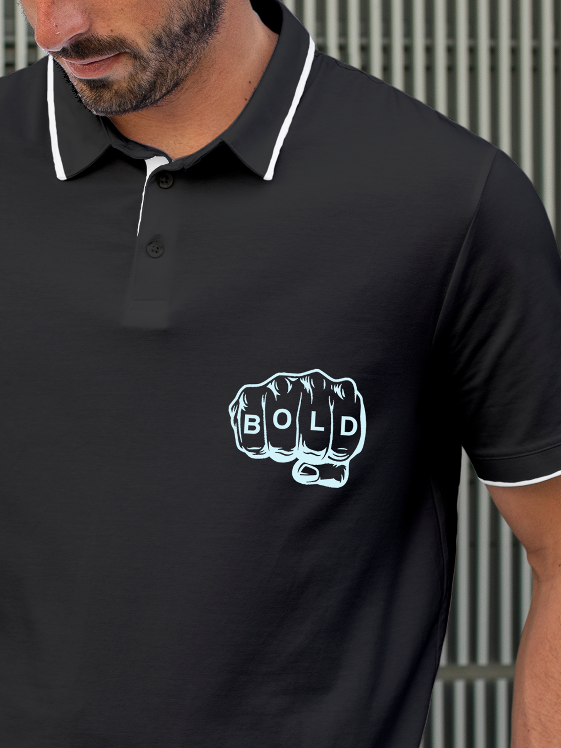 Close up of 'Bold' design on Men's Charcoal Grey Polo T-shirt, highlighting intricate details and vibrant print.