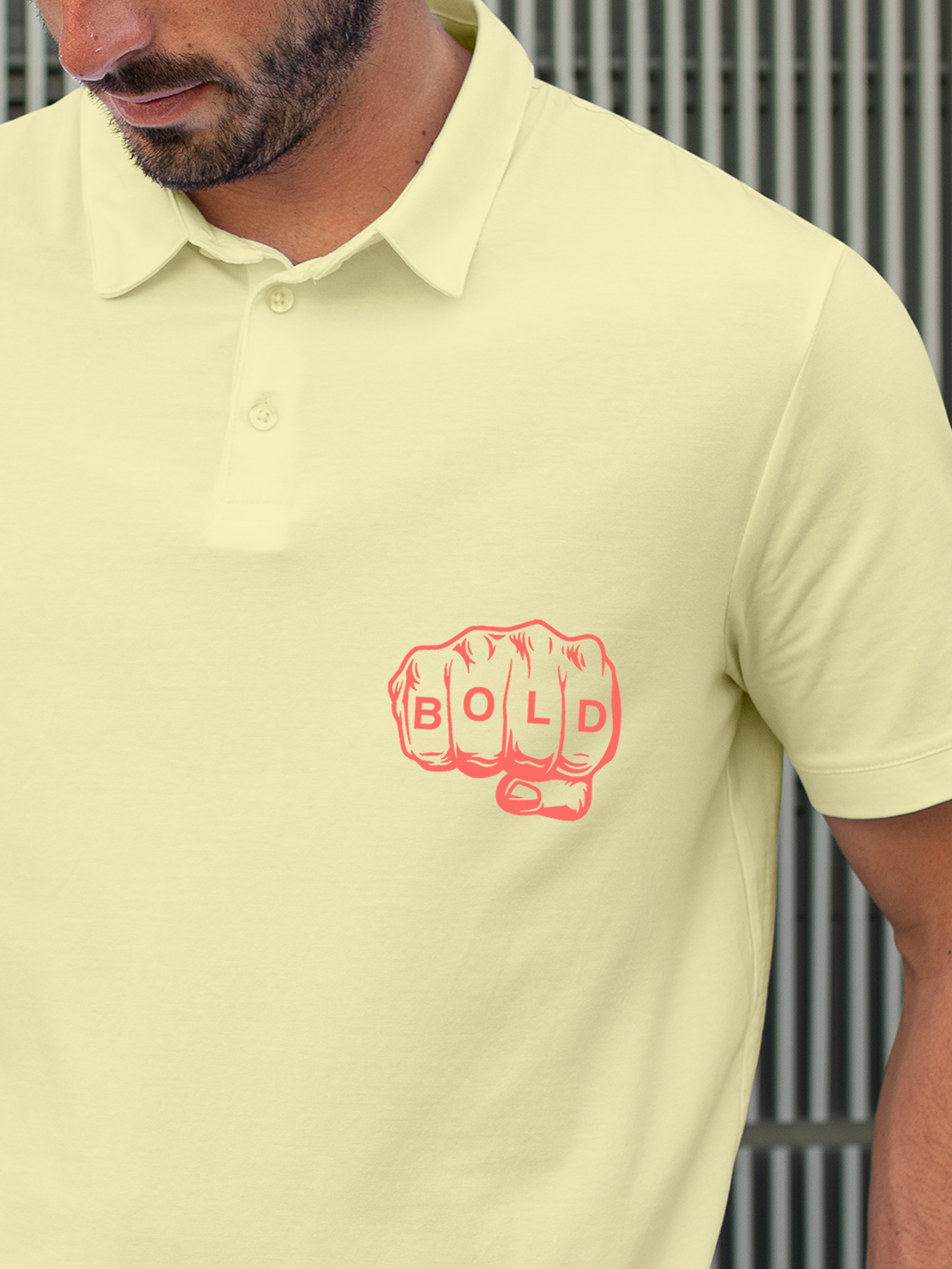 Close up of 'Bold' design on Men's Yellow Polo T-shirt, highlighting intricate details and vibrant print.