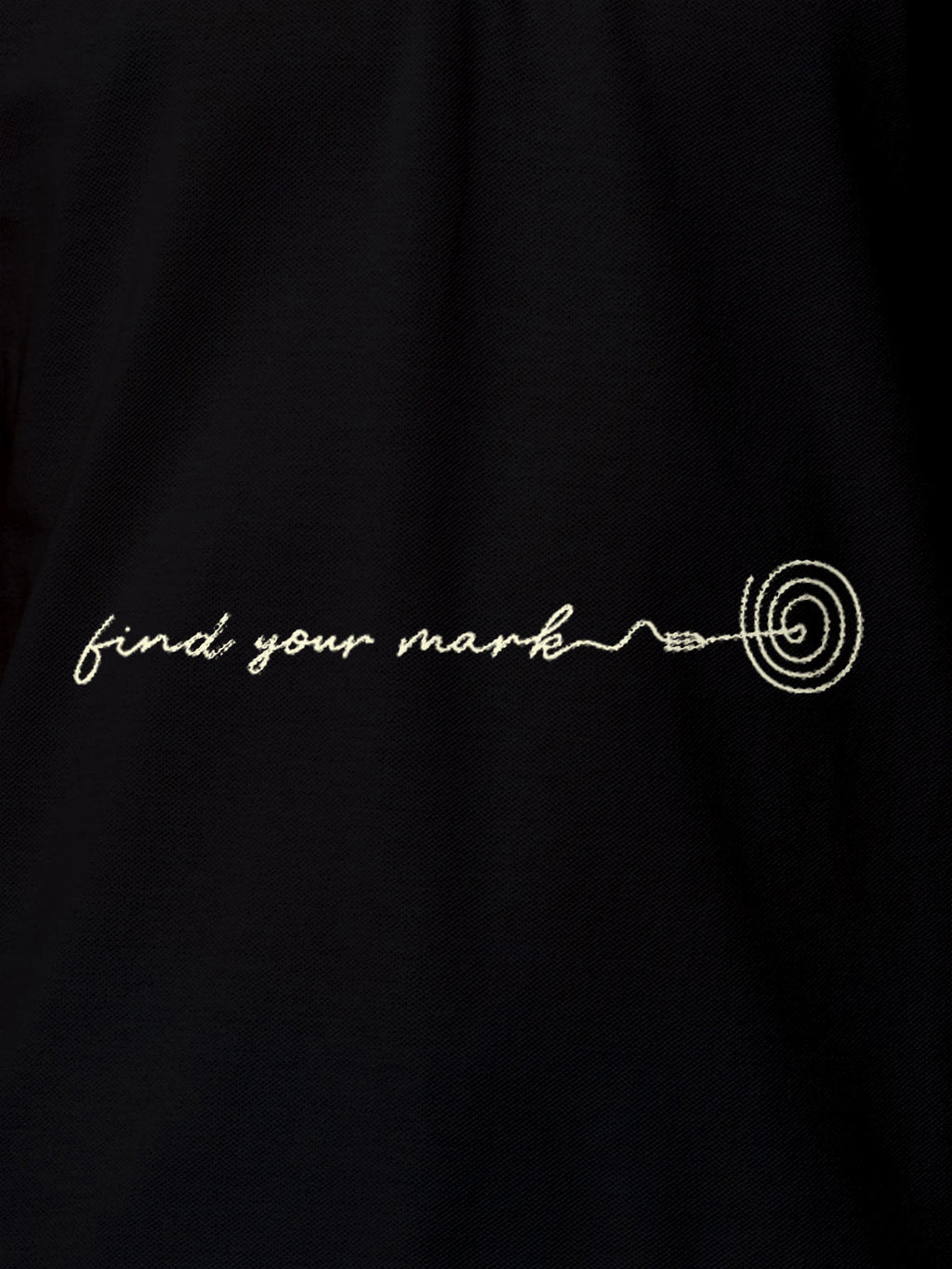 Close up of 'Find Your Mark' design on Men's Black Polo T-shirt, highlighting intricate details and vibrant print.