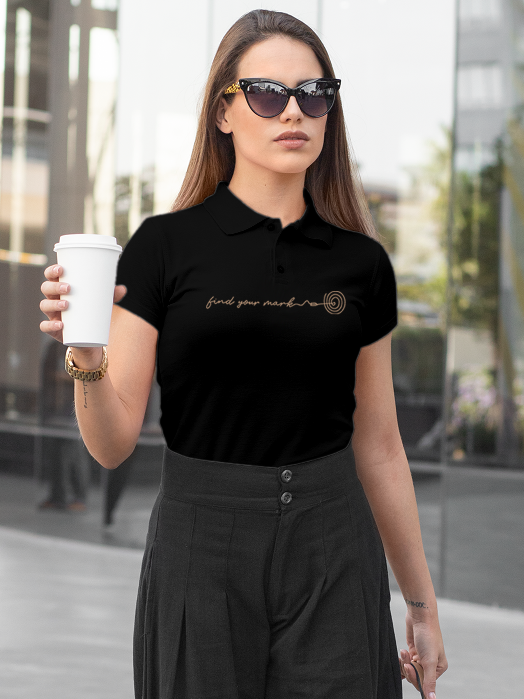 Model wearing Women's Black Polo T-shirt with 'Find Your Mark' design, offering effortless style and premium comfort