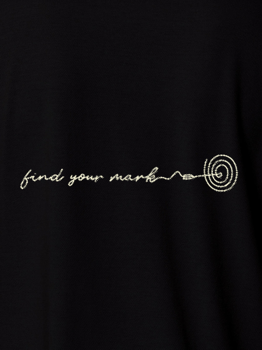 Close up of 'Find Your Mark' design on Women's Black Polo T-shirt, highlighting intricate details and vibrant print.