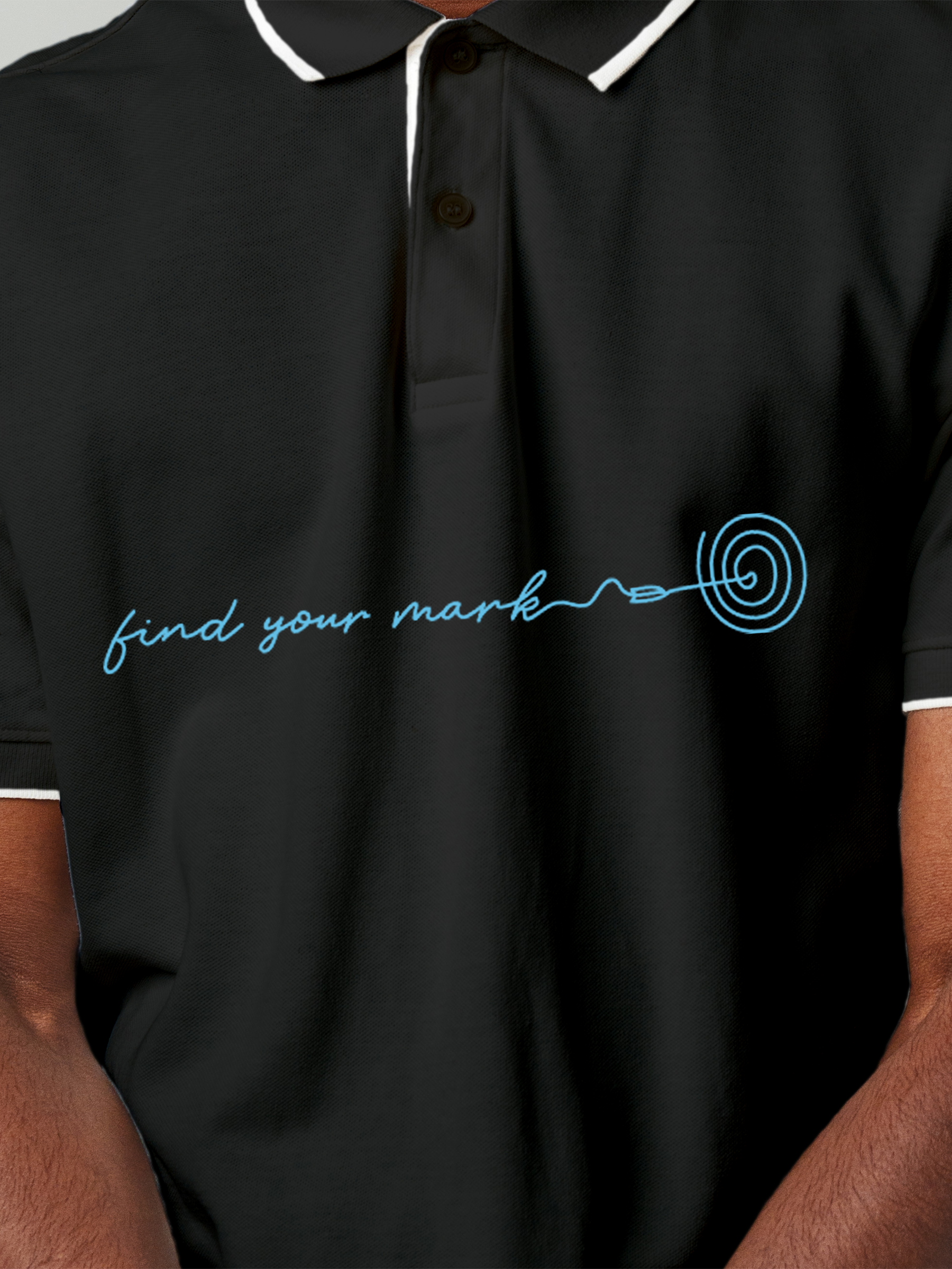 Close up of 'Find Your Mark' design on Men's Charcoal Grey Polo T-shirt, highlighting intricate details and vibrant print.