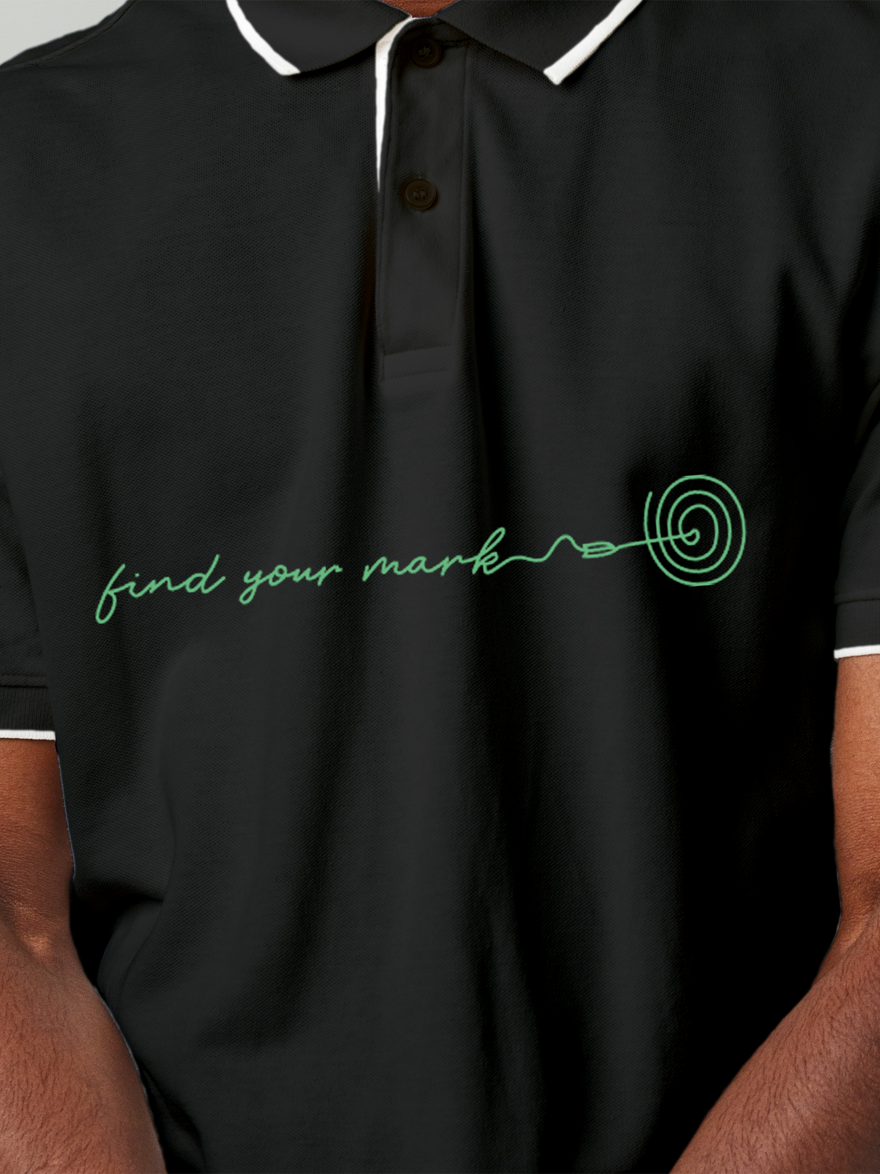 Close up of 'Find Your Mark' design on Men's Charcoal Grey Polo T-shirt, highlighting intricate details and vibrant print.