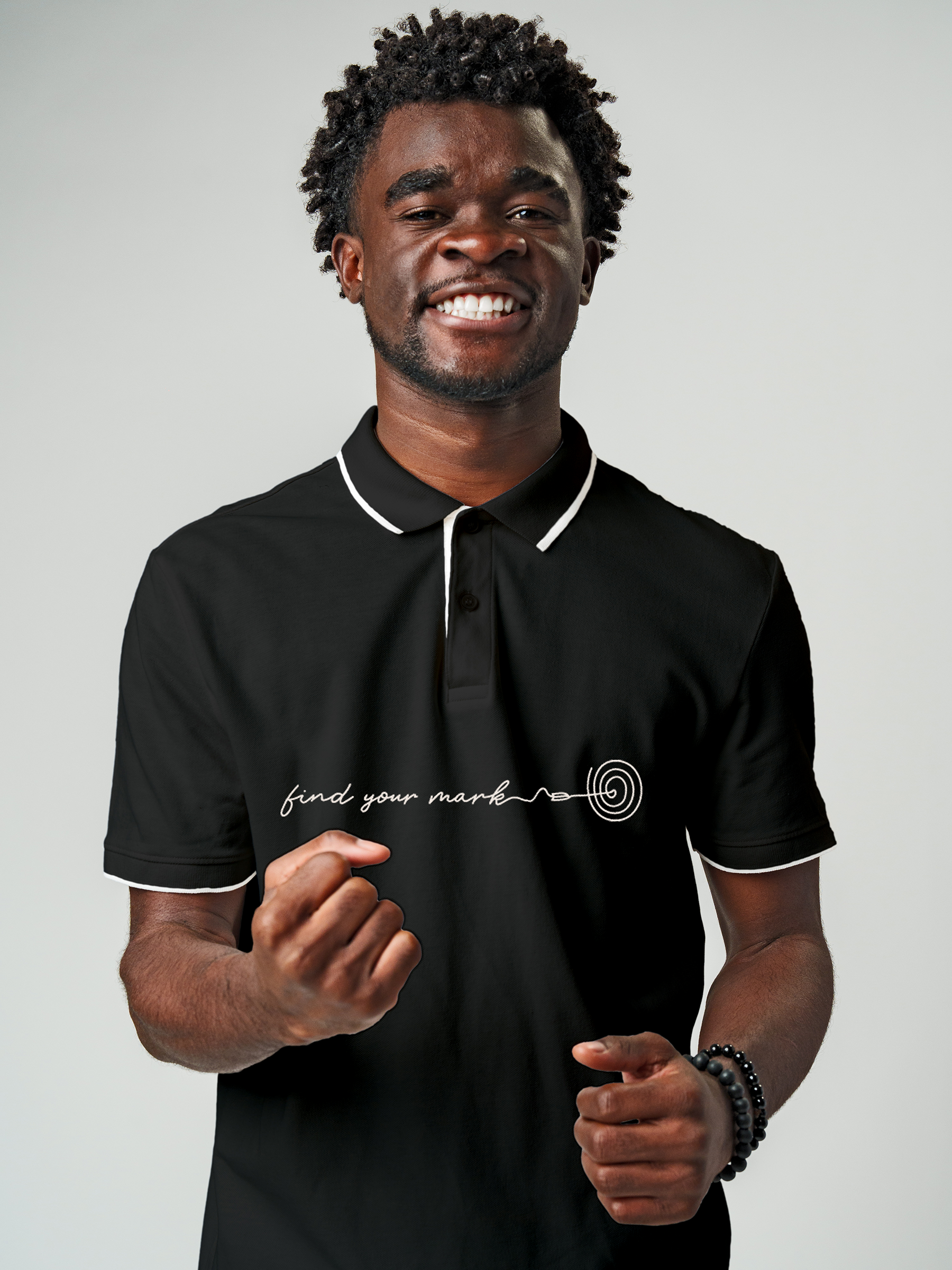 Model wearing Men's Charcoal Grey Polo T-shirt with 'Find Your Mark' design, offering effortless style and premium comfort