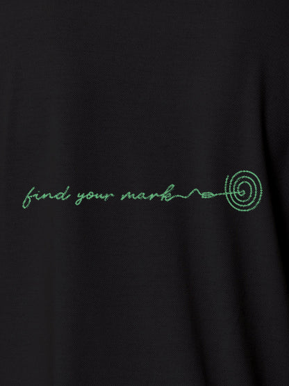 Close up of 'Find Your Mark' design on Women's Dark Grey Polo T-shirt, highlighting intricate details and vibrant print.