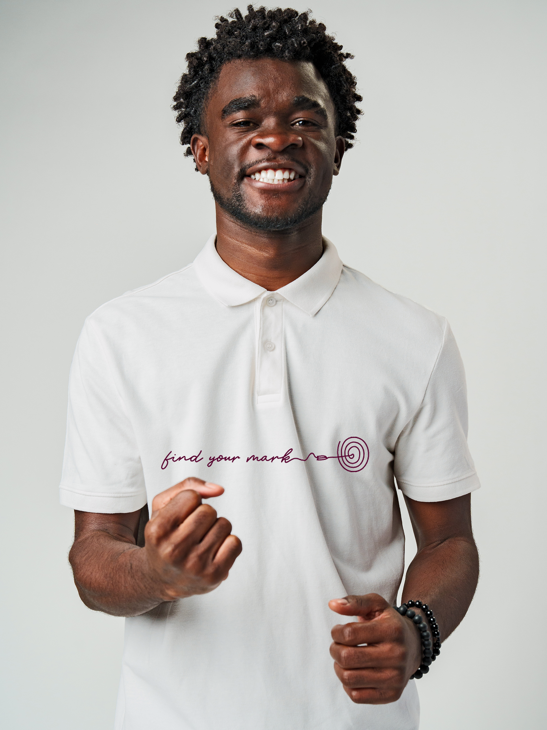 Model wearing Men's White Polo T-shirt with 'Find Your Mark' design, offering effortless style and premium comfort