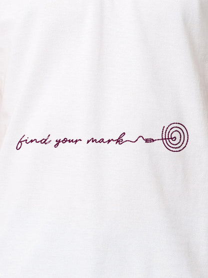 Close up of 'Find Your Mark' design on Men's White Polo T-shirt, highlighting intricate details and vibrant print.