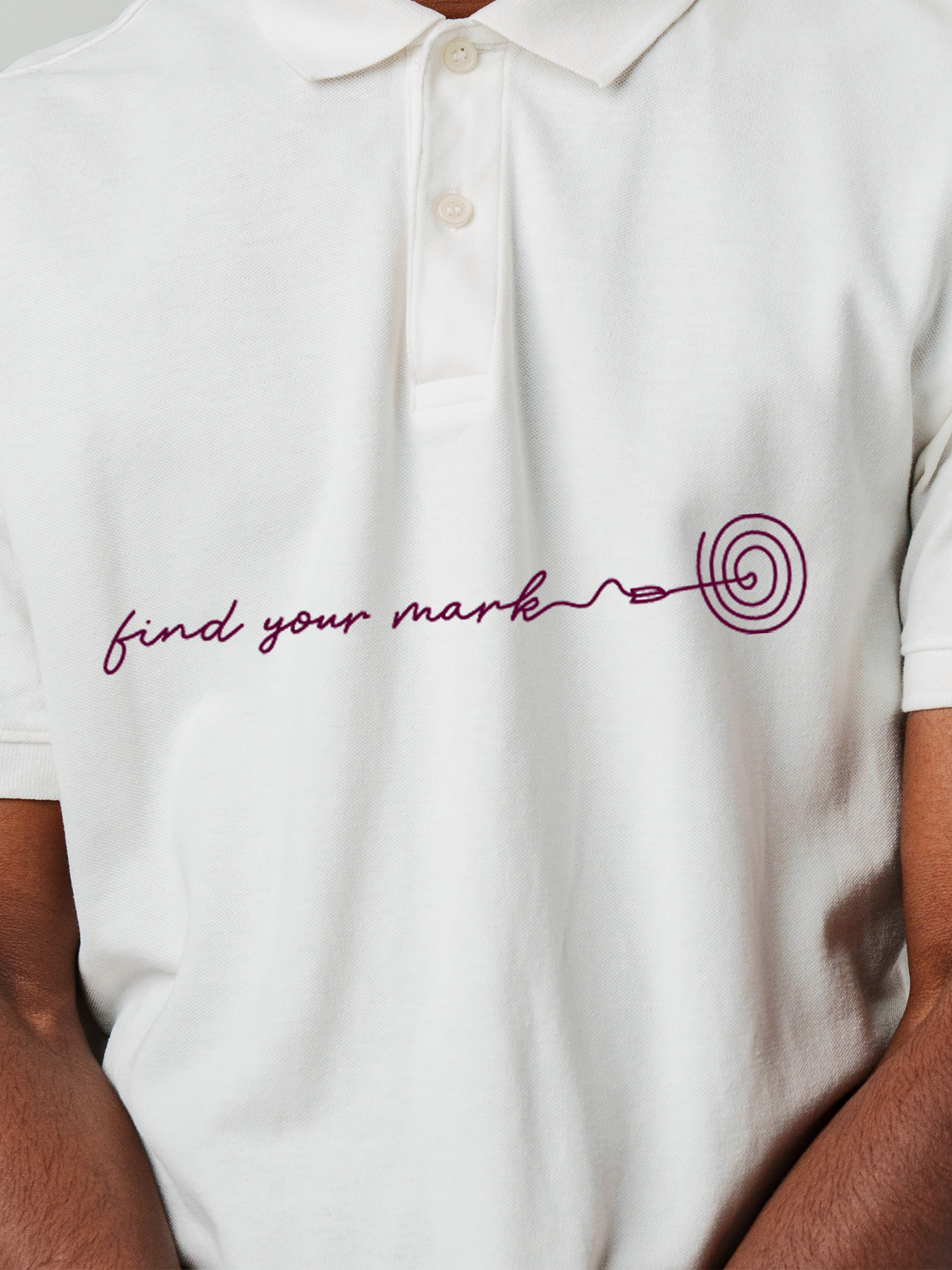 Close up of 'Find Your Mark' design on Men's White Polo T-shirt, highlighting intricate details and vibrant print.