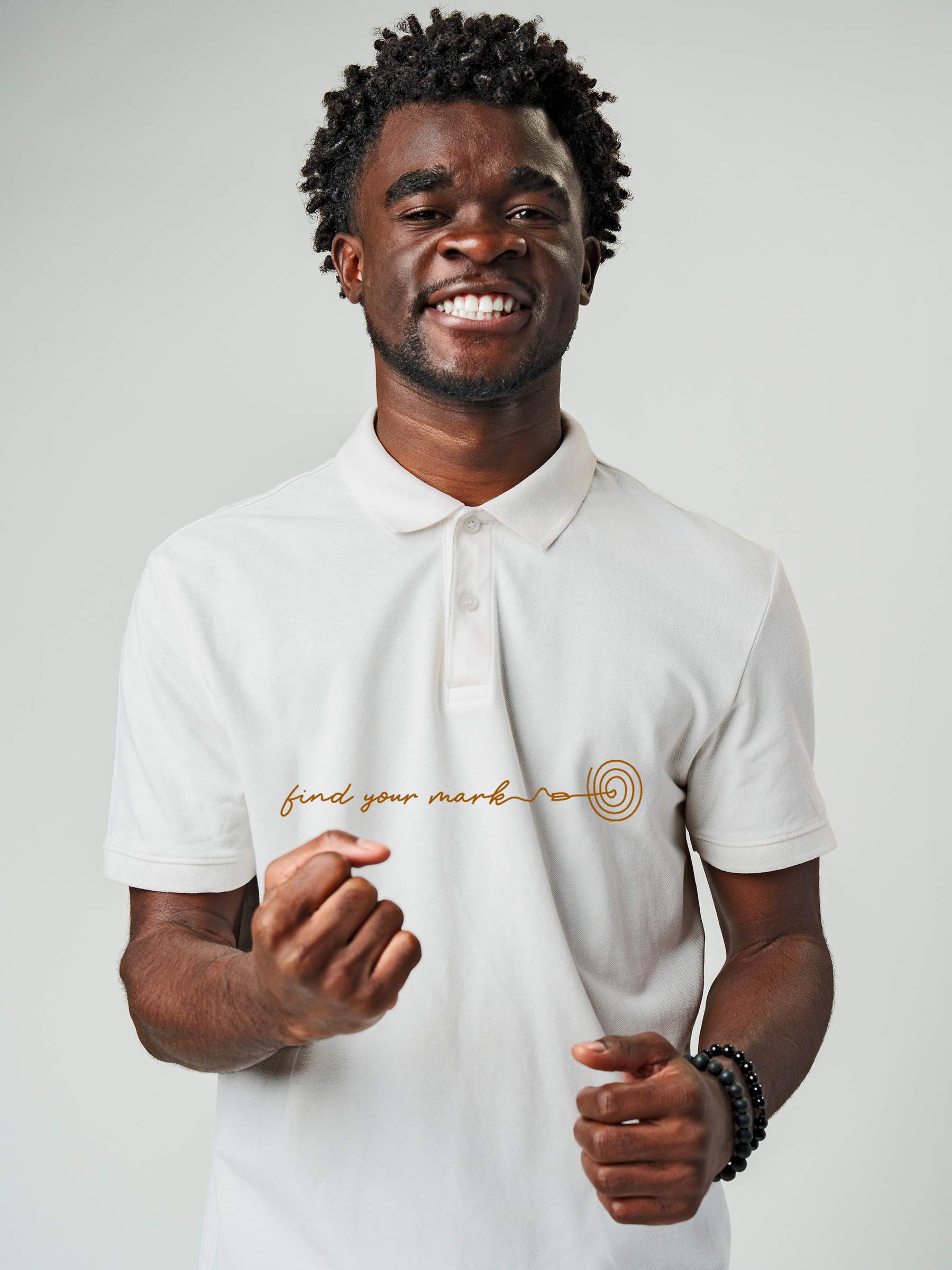 Model wearing Men's White Polo T-shirt with 'Find Your Mark' design, offering effortless style and premium comfort