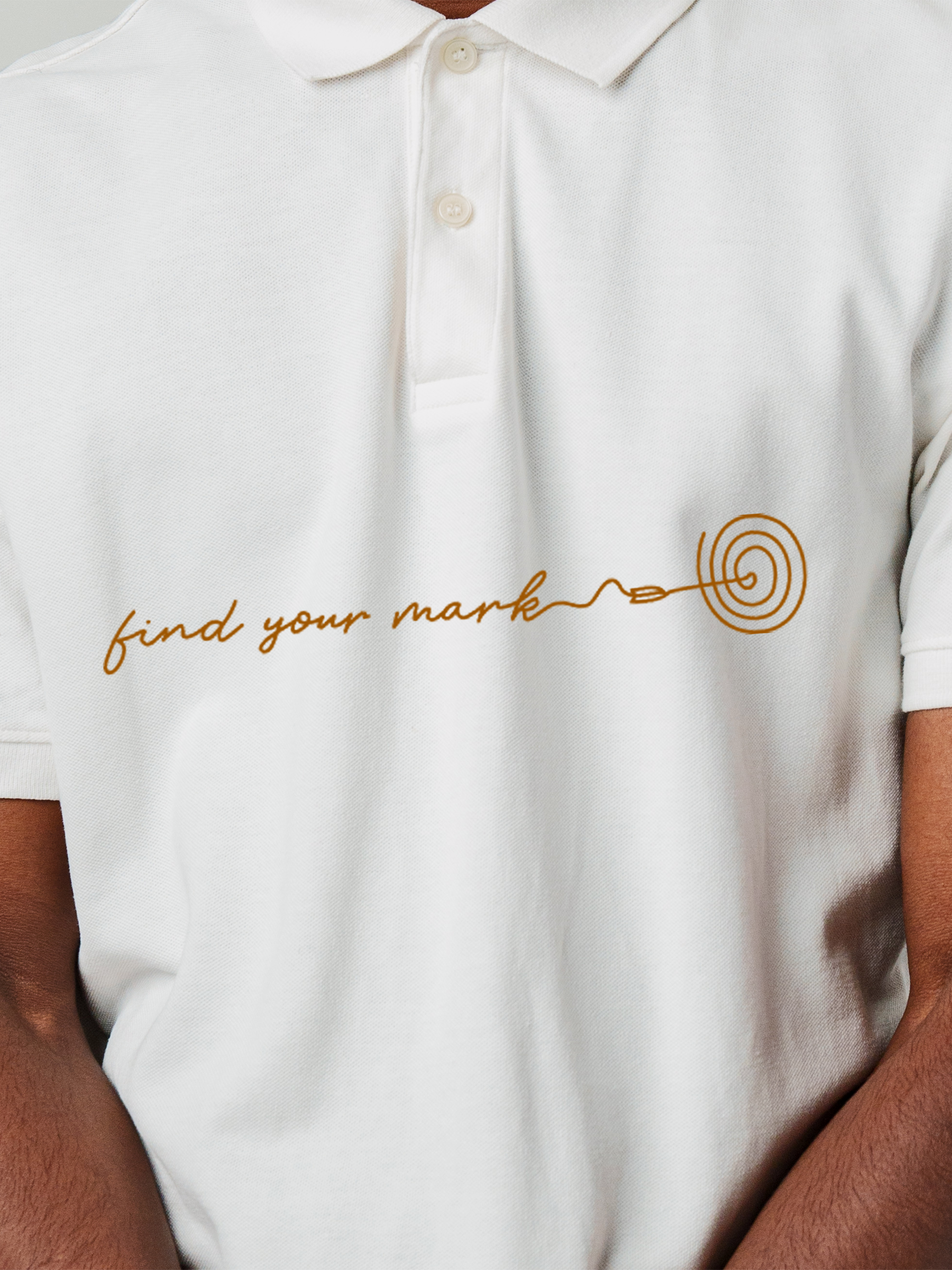 Close up of 'Find Your Mark' design on Men's White Polo T-shirt, highlighting intricate details and vibrant print.