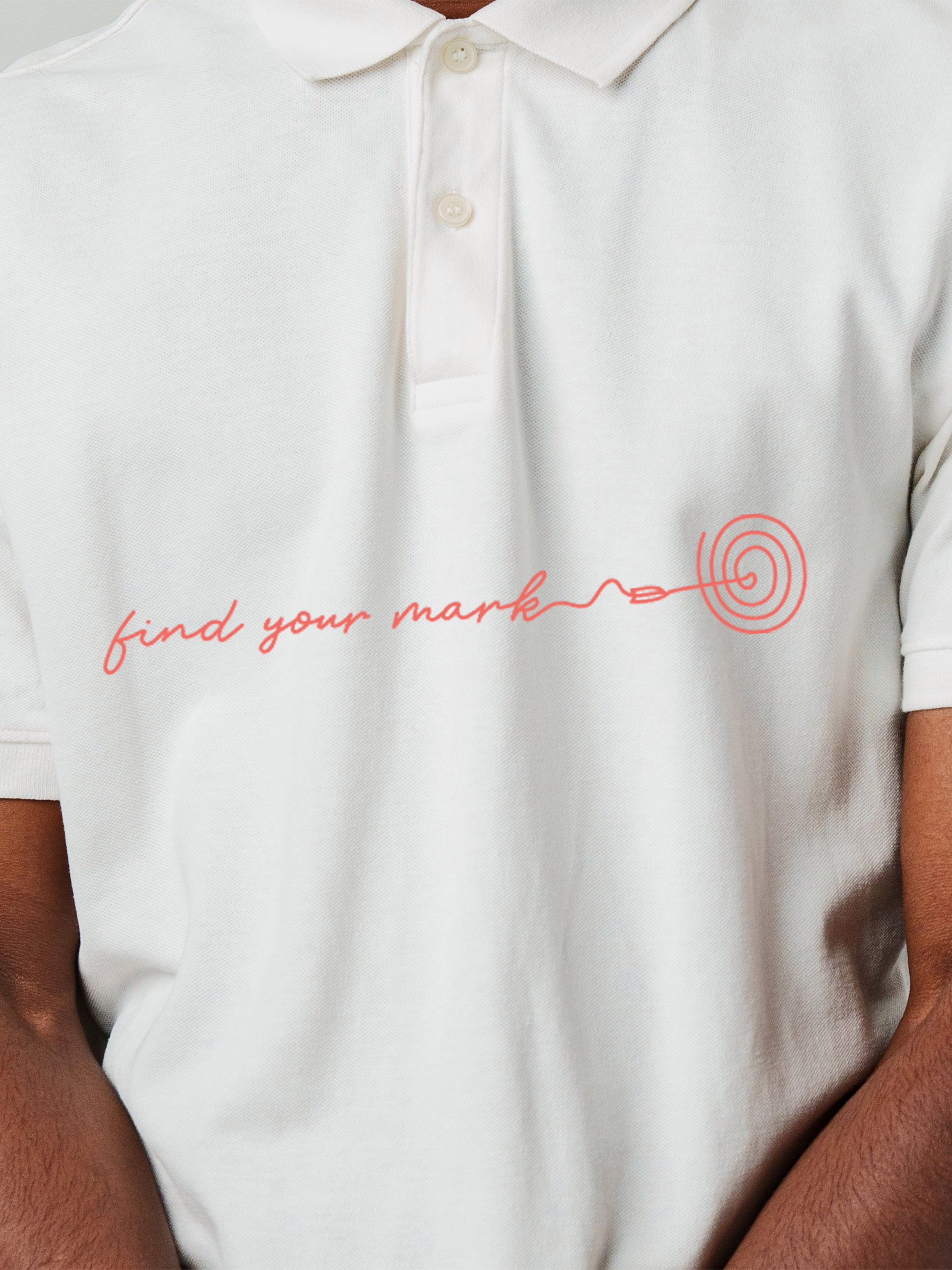 Close up of 'Find Your Mark' design on Men's White Polo T-shirt, highlighting intricate details and vibrant print.