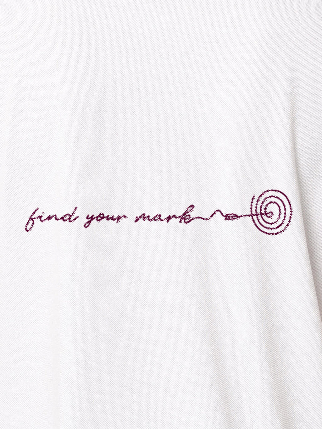 Close up of 'Find Your Mark' design on Women's White Polo T-shirt, highlighting intricate details and vibrant print.