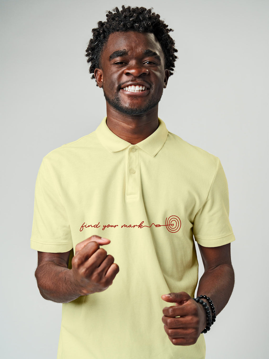 Model wearing Men's Yellow Polo T-shirt with 'Find Your Mark' design, offering effortless style and premium comfort