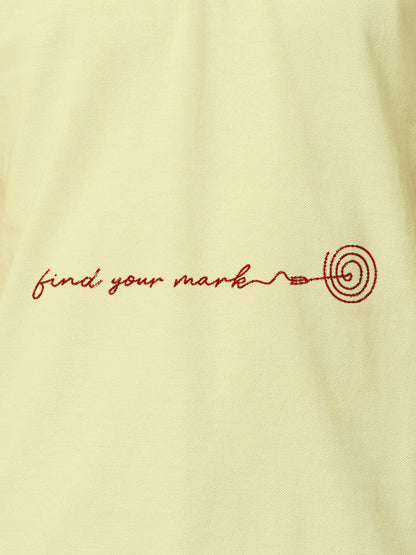 Close up of 'Find Your Mark' design on Men's Yellow Polo T-shirt, highlighting intricate details and vibrant print.