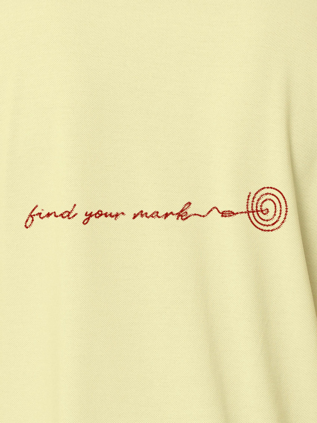 Close up of 'Find Your Mark' design on Women's Yellow Polo T-shirt, highlighting intricate details and vibrant print.