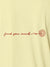 Close up of 'Find Your Mark' design on Women's Yellow Polo T-shirt, highlighting intricate details and vibrant print.
