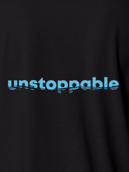 Close up of 'Unstoppable' design on Men's Dark Grey Polo T-shirt, highlighting intricate details and vibrant print.
