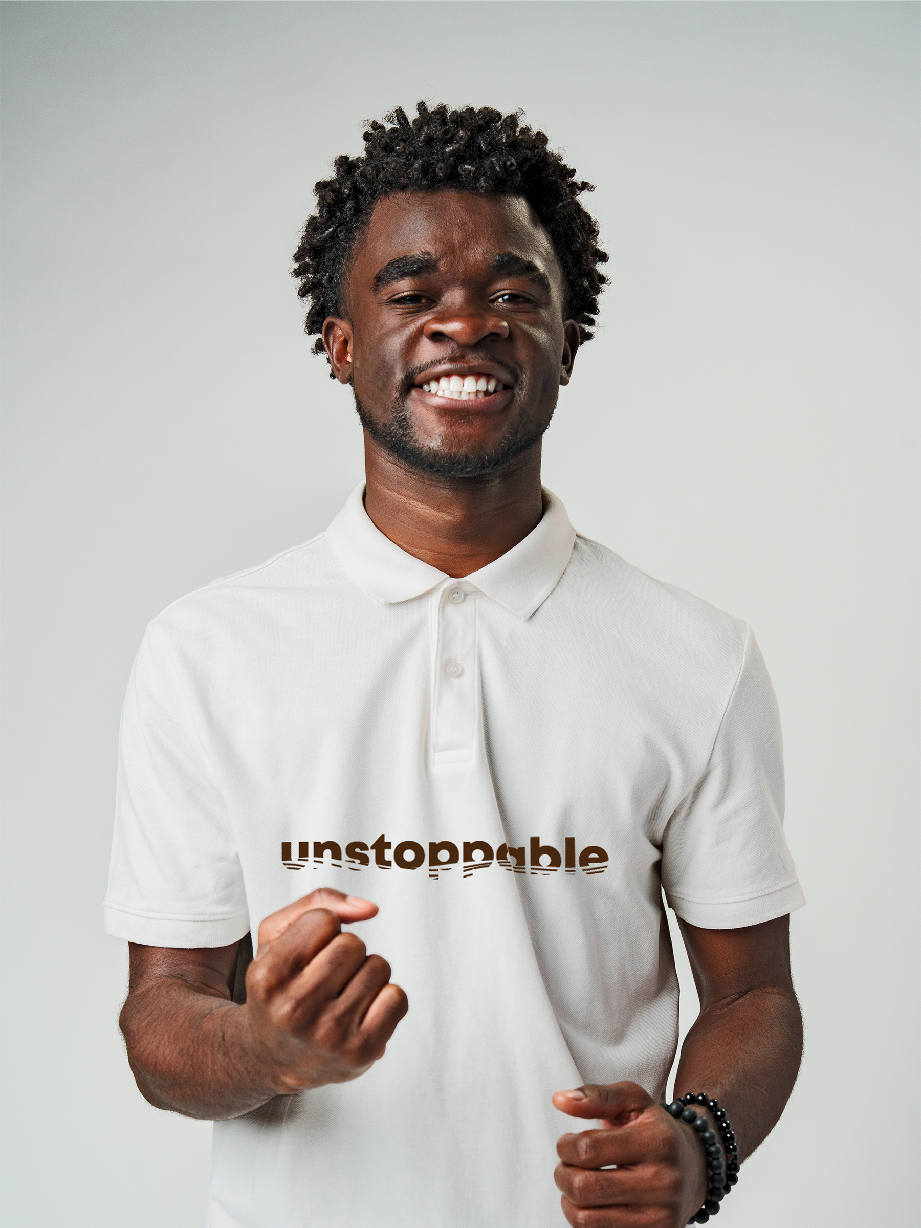 Fighterhero Polo Collection: Model wearing Men's White Polo T-shirt with 'Unstoppable' design