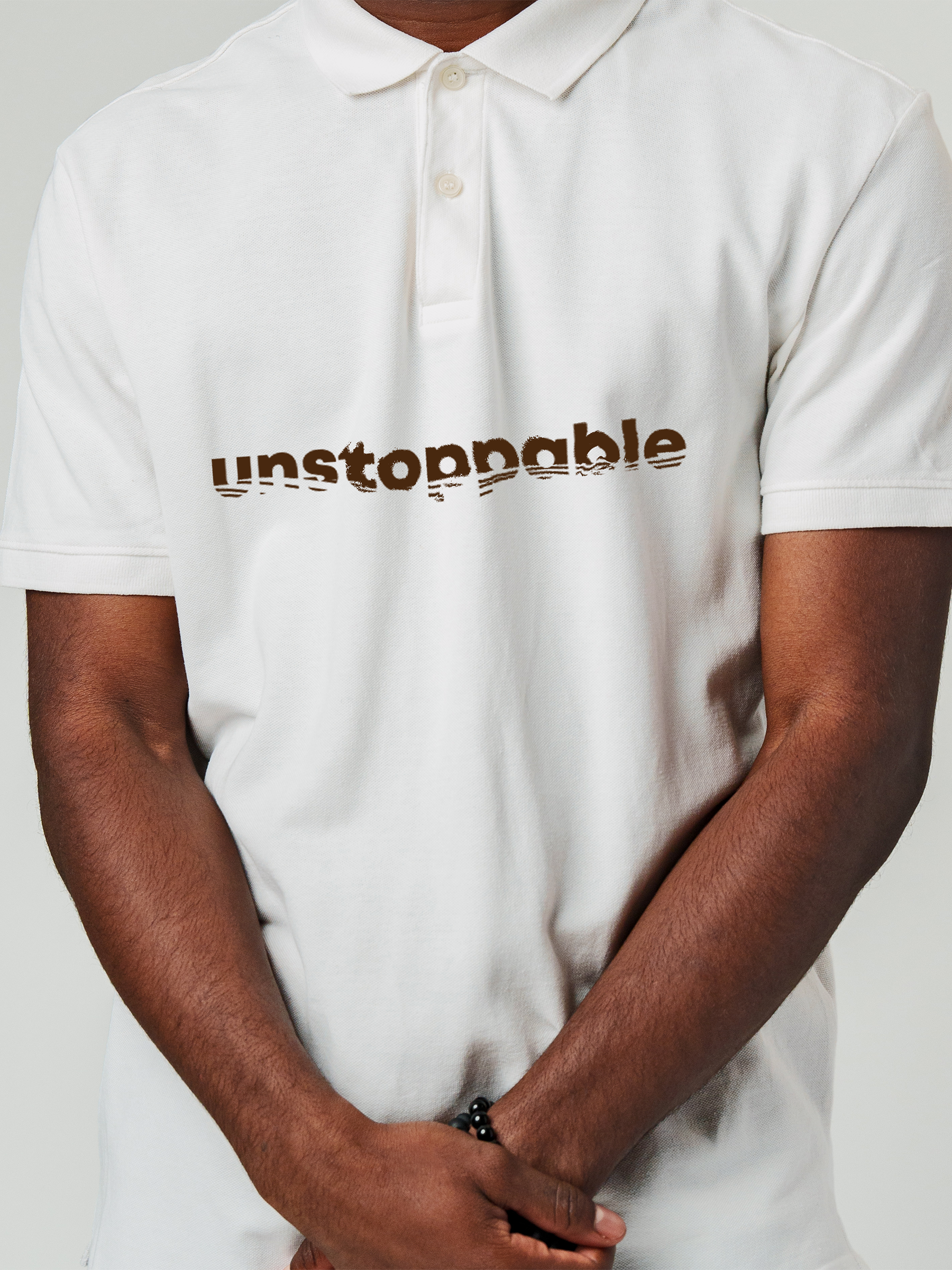 Close up of 'Unstoppable' design on Men's White Polo T-shirt, highlighting intricate details and vibrant print.