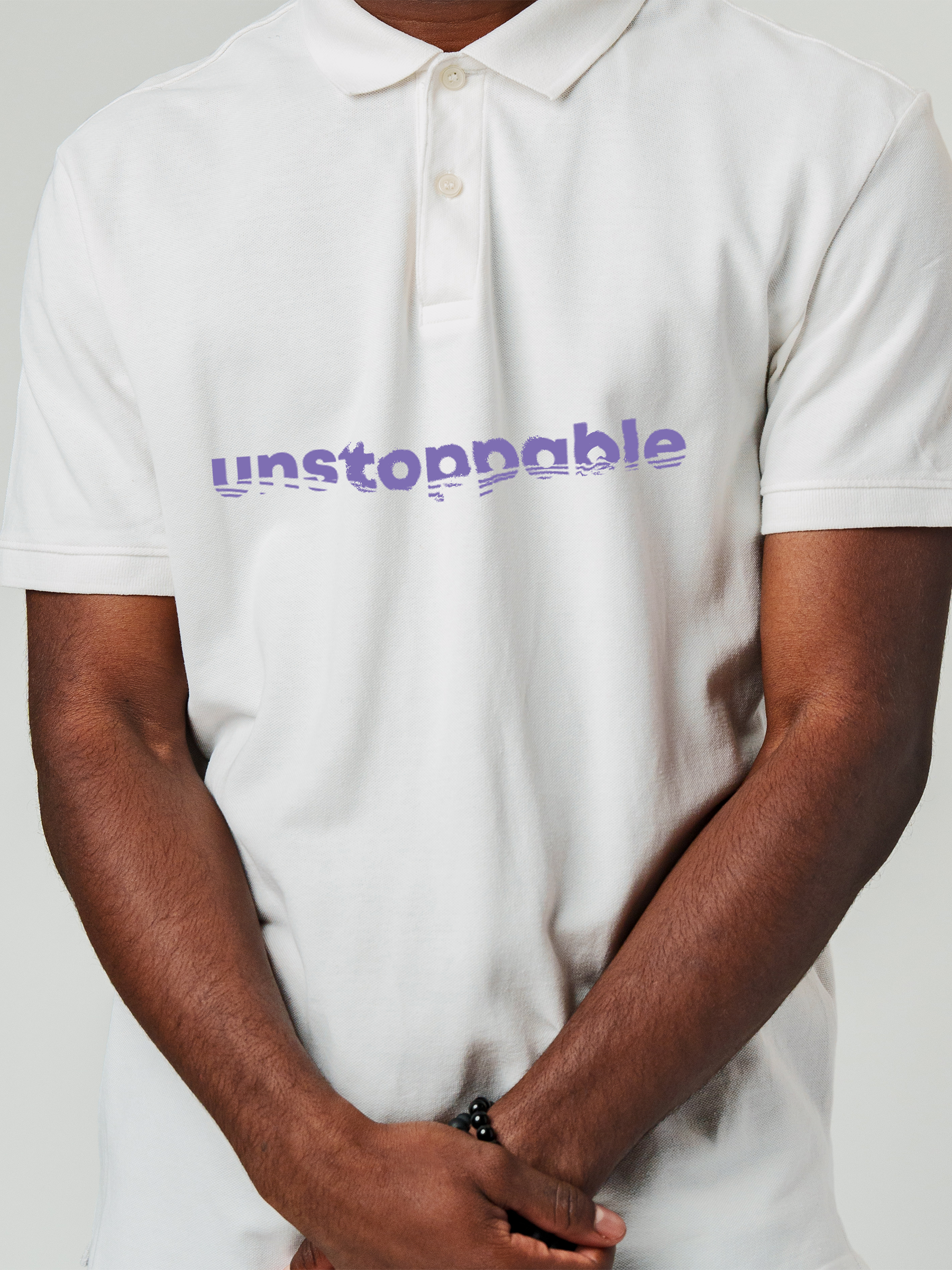 Close up of 'Unstoppable' design on Men's White Polo T-shirt, highlighting intricate details and vibrant print.