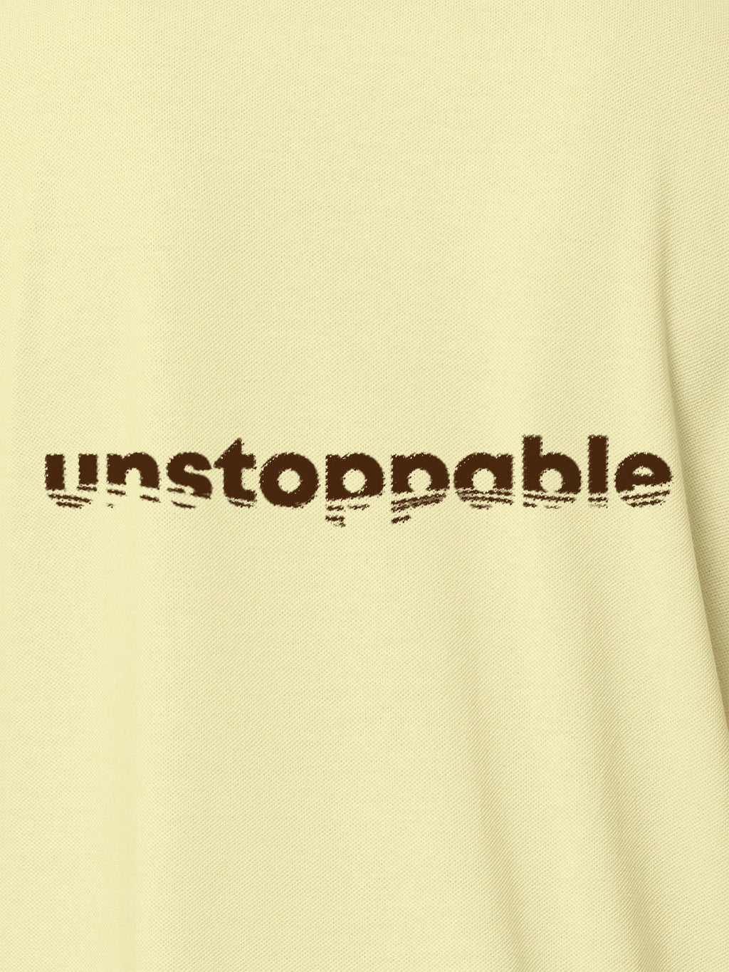 Close up of 'Unstoppable' design on Men's Yellow Polo T-shirt, highlighting intricate details and vibrant print.