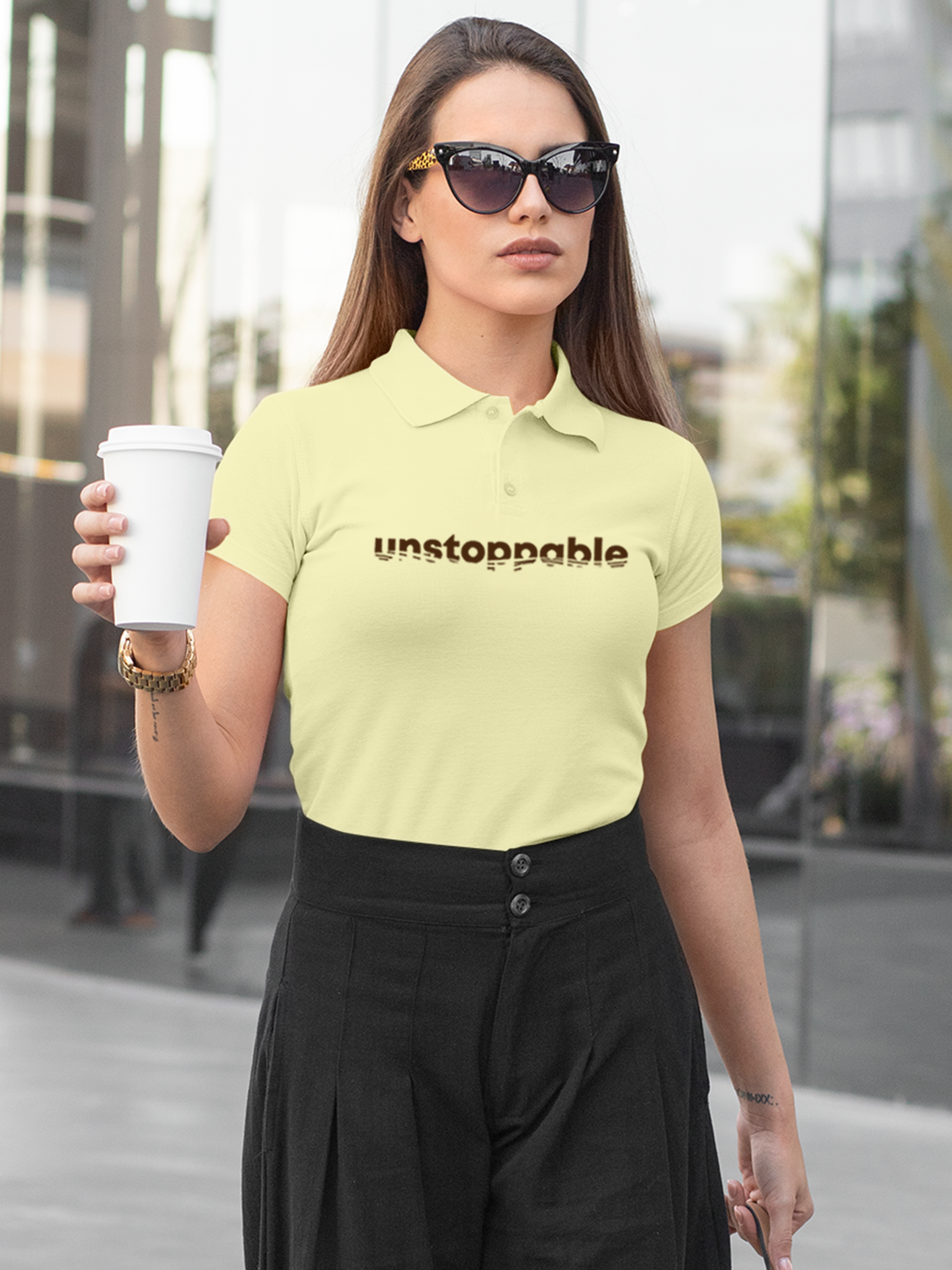 Fighterhero Polo Collection: Model wearing Women's Yellow Polo T-shirt with 'Unstoppable' design