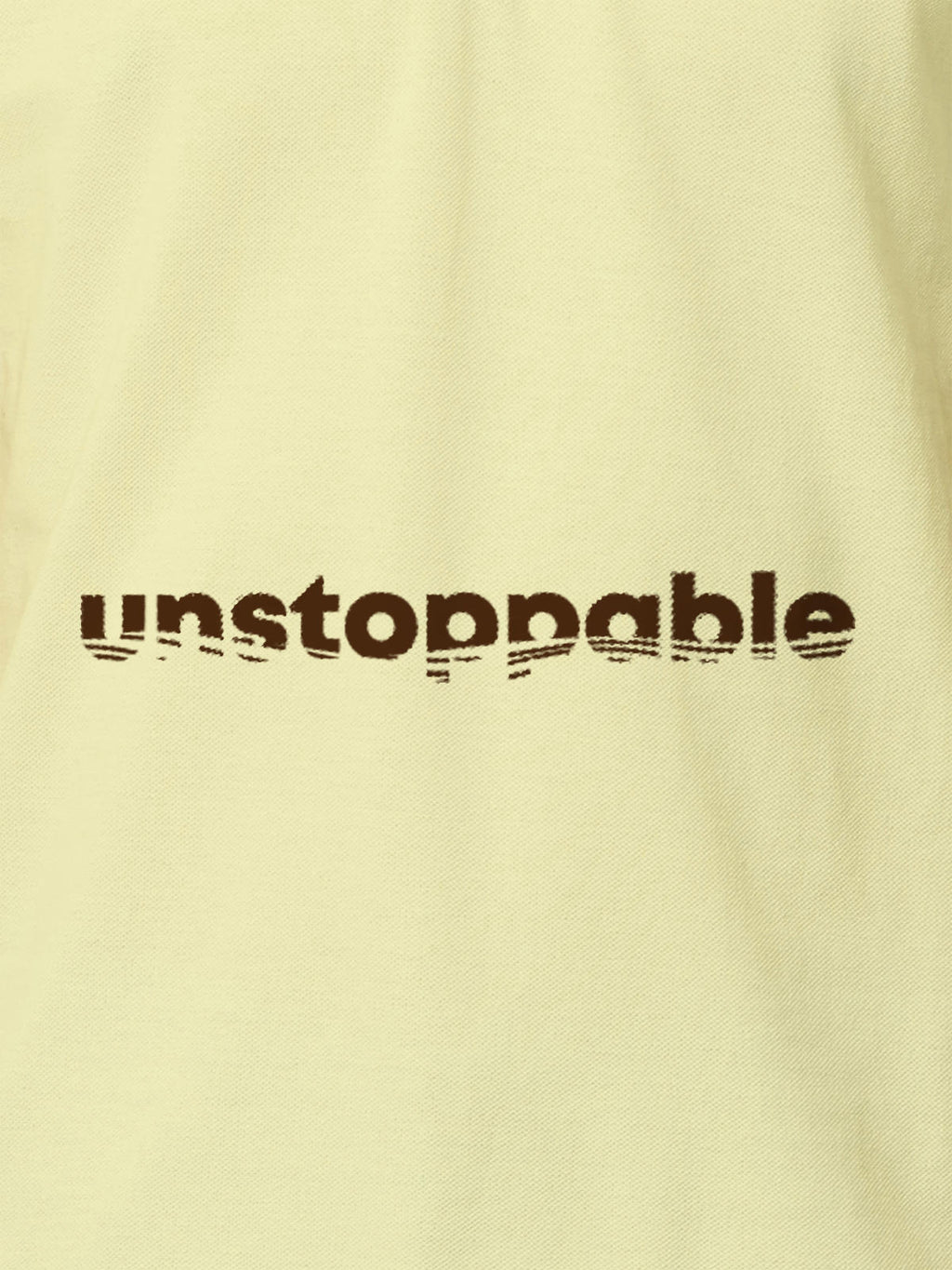Close up of 'Unstoppable' design on Women's Yellow Polo T-shirt, highlighting intricate details and vibrant print.