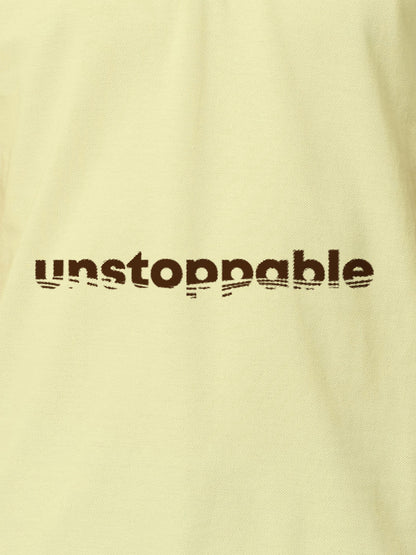 Close up of 'Unstoppable' design on Women's Yellow Polo T-shirt, highlighting intricate details and vibrant print.