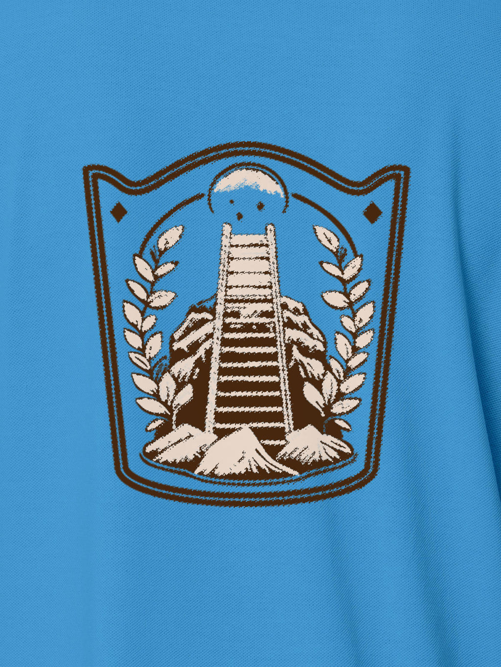 Close up of 'Ambition' design on Women's Blue Polo T-shirt, highlighting intricate details and vibrant print.