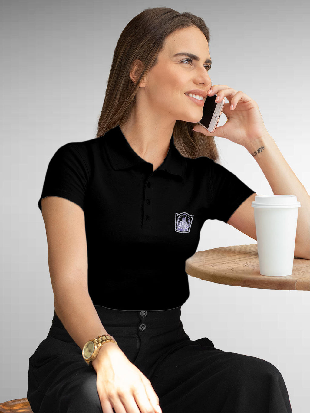 Model wearing Women's Black Polo T-shirt with 'Ambition' design, offering effortless style and premium comfort