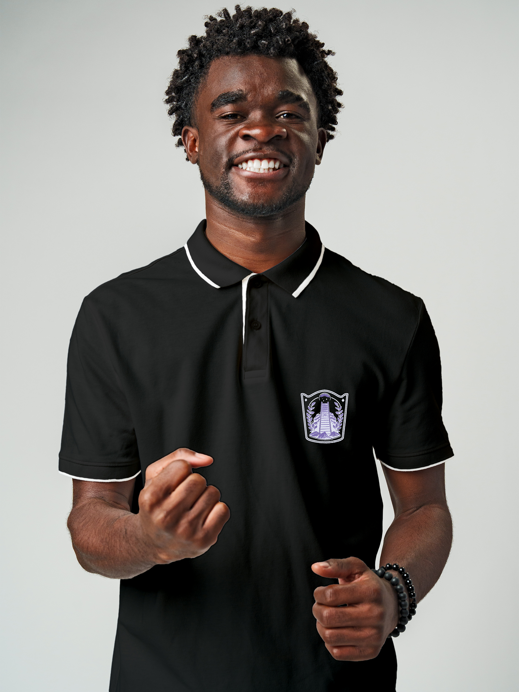 Model wearing Men's Charcoal Grey Polo T-shirt with 'Ambition' design, offering effortless style and premium comfort