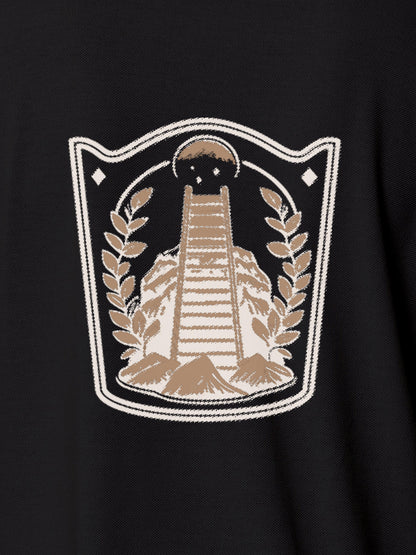 Close up of 'Ambition' design on Women's Dark Grey Polo T-shirt, highlighting intricate details and vibrant print.