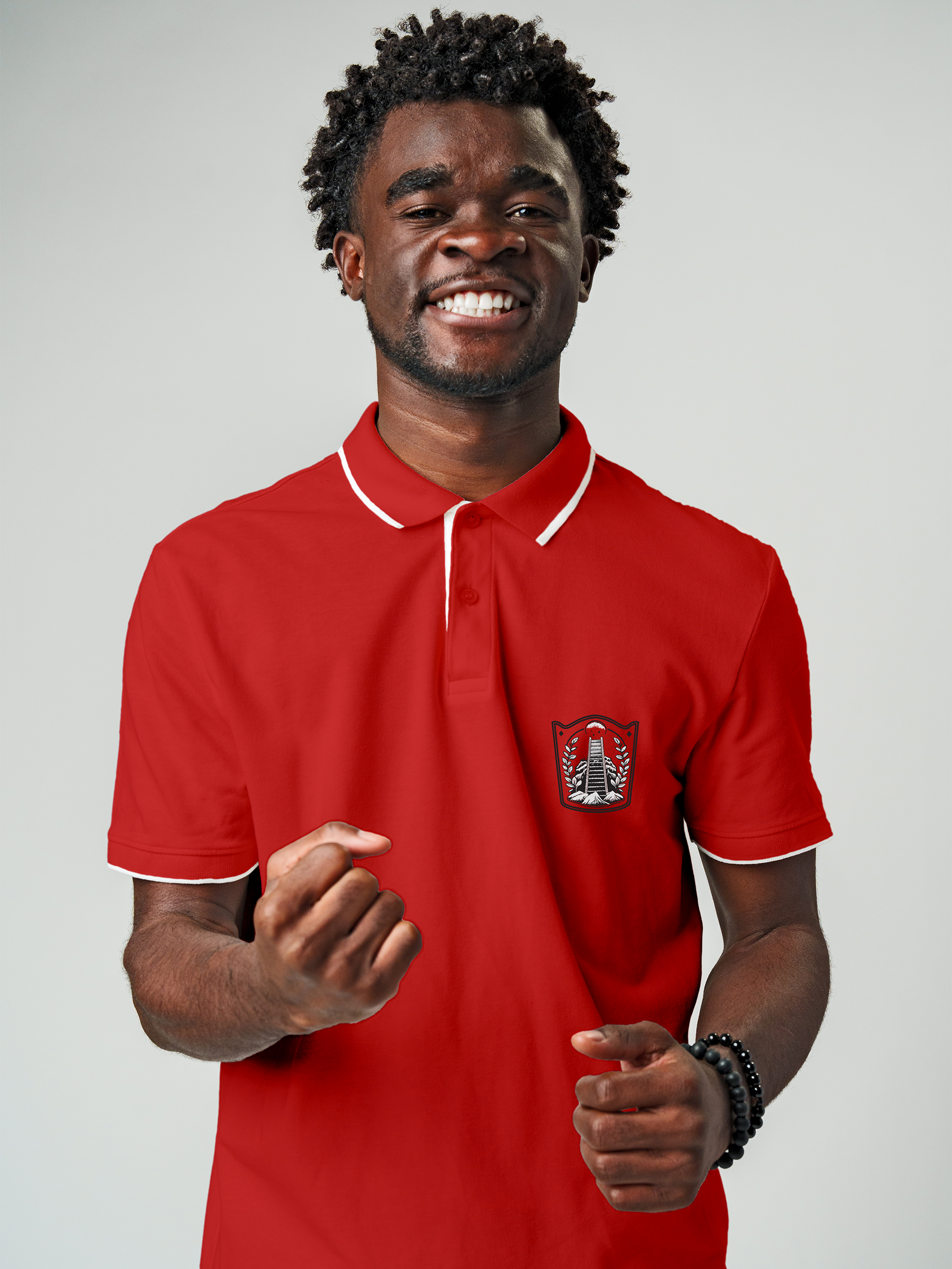 Model wearing Men's Red Polo T-shirt with 'Ambition' design, offering effortless style and premium comfort