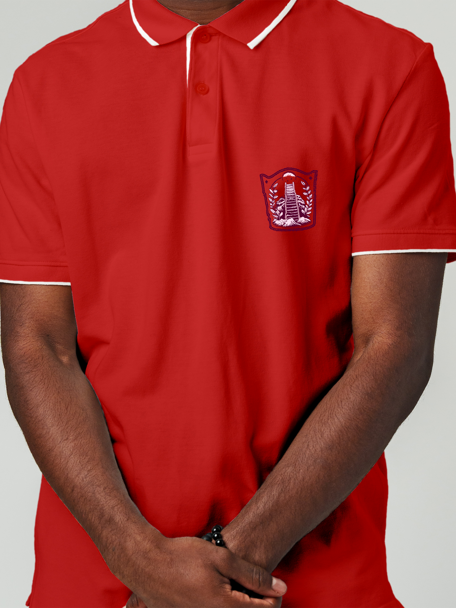 Close up of 'Ambition' design on Men's Red Polo T-shirt, highlighting intricate details and vibrant print.