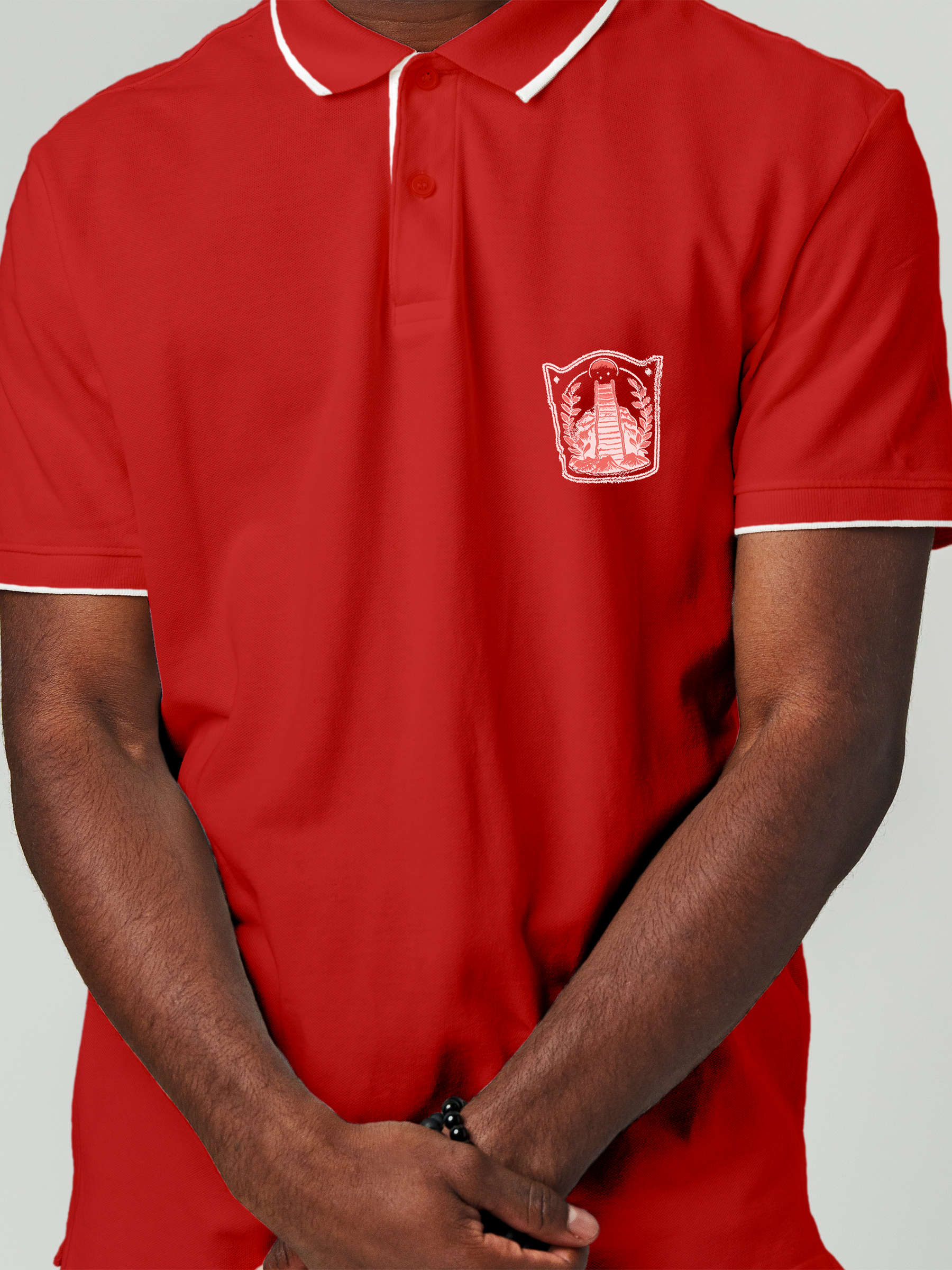 Close up of 'Ambition' design on Men's Red Polo T-shirt, highlighting intricate details and vibrant print.