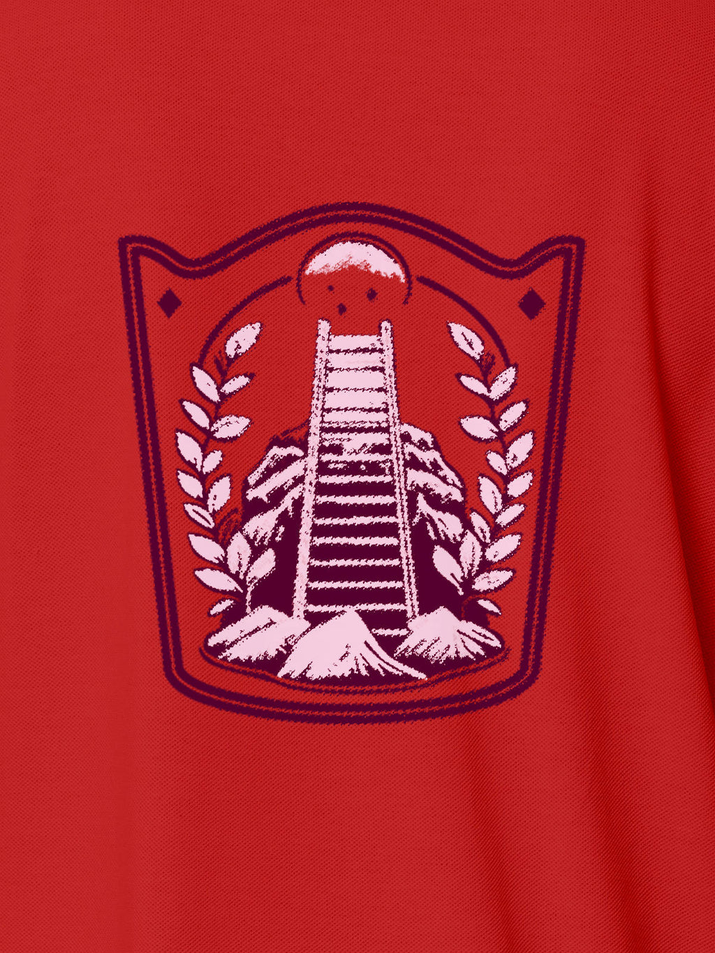 Close up of 'Ambition' design on Women's Red Polo T-shirt, highlighting intricate details and vibrant print.