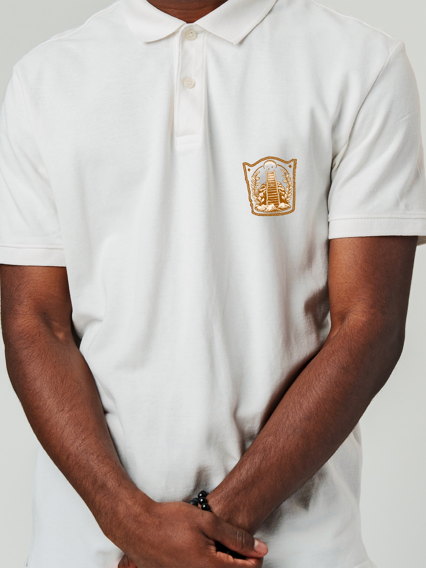 Close up of 'Ambition' design on Men's White Polo T-shirt, highlighting intricate details and vibrant print.