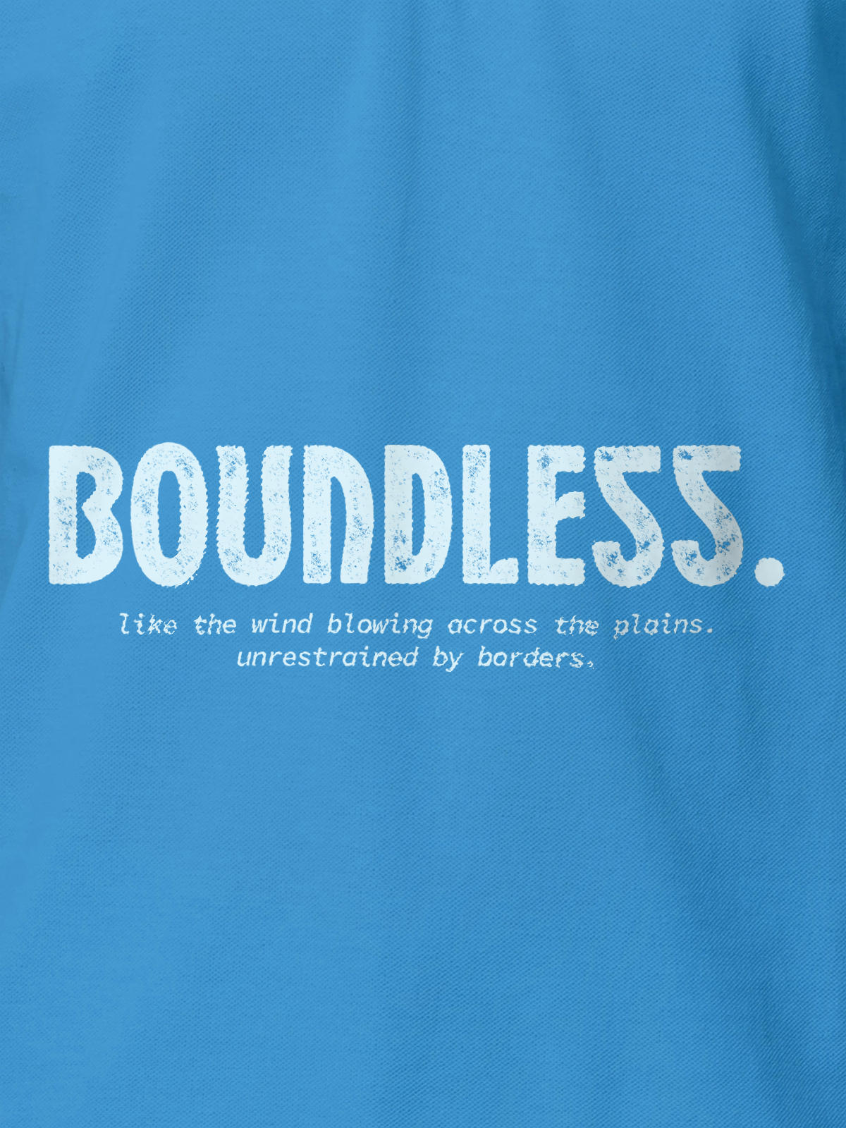 Close up of 'Free & Boundless' design on Men's Blue Polo T-shirt, highlighting intricate details and vibrant print.