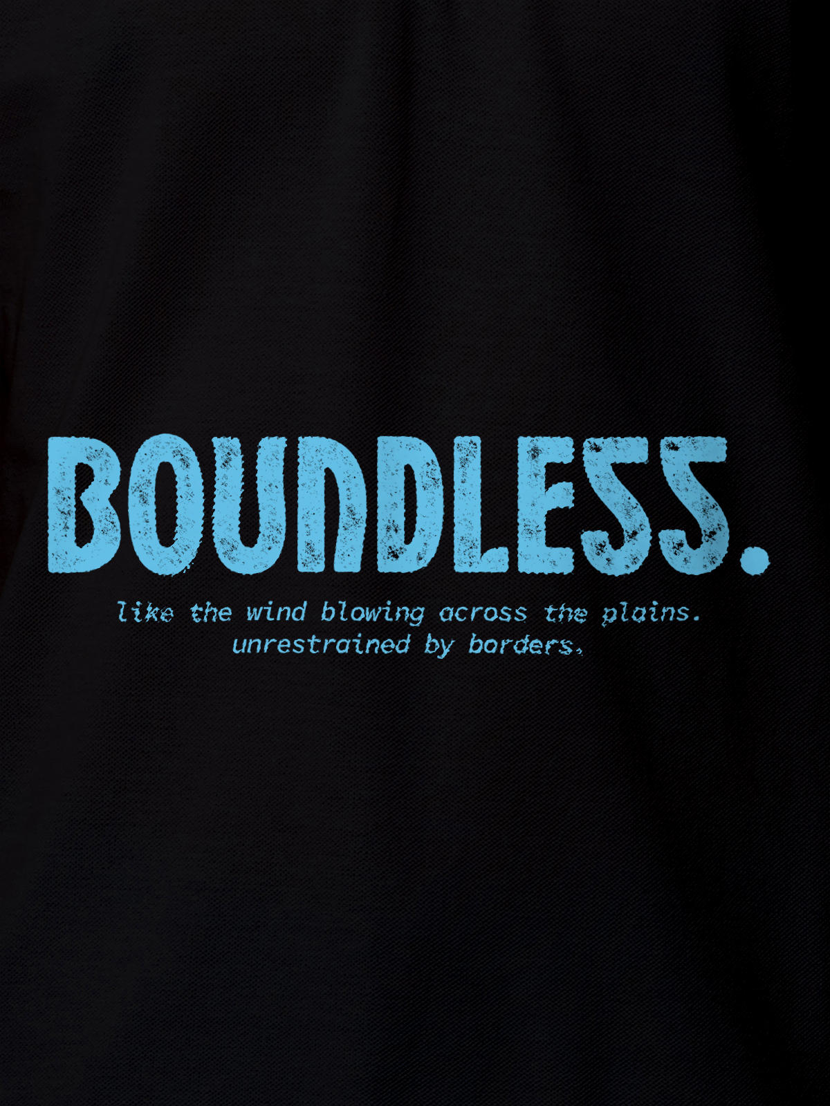 Close up of 'Free & Boundless' design on Men's Black Polo T-shirt, highlighting intricate details and vibrant print.