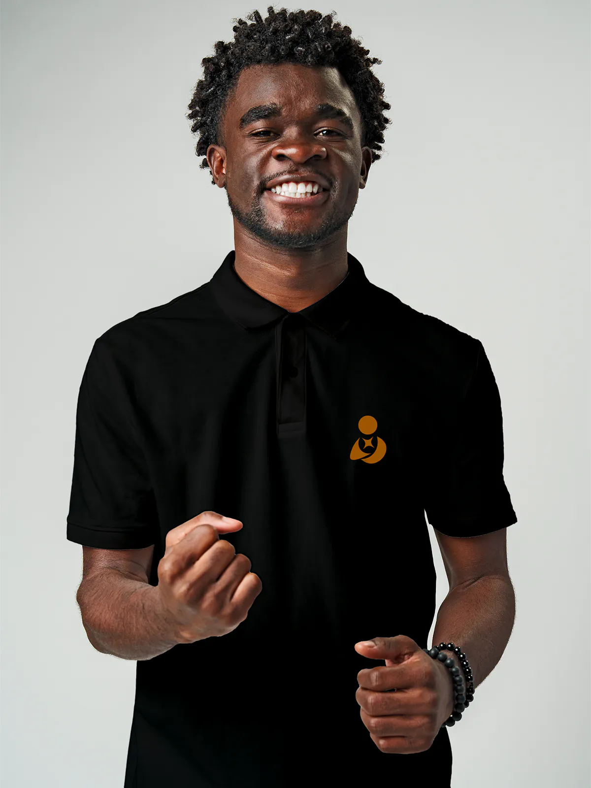 Close up of 'Free & Boundless' design on Men's Black Collar T-shirt, highlighting intricate details and vibrant print.