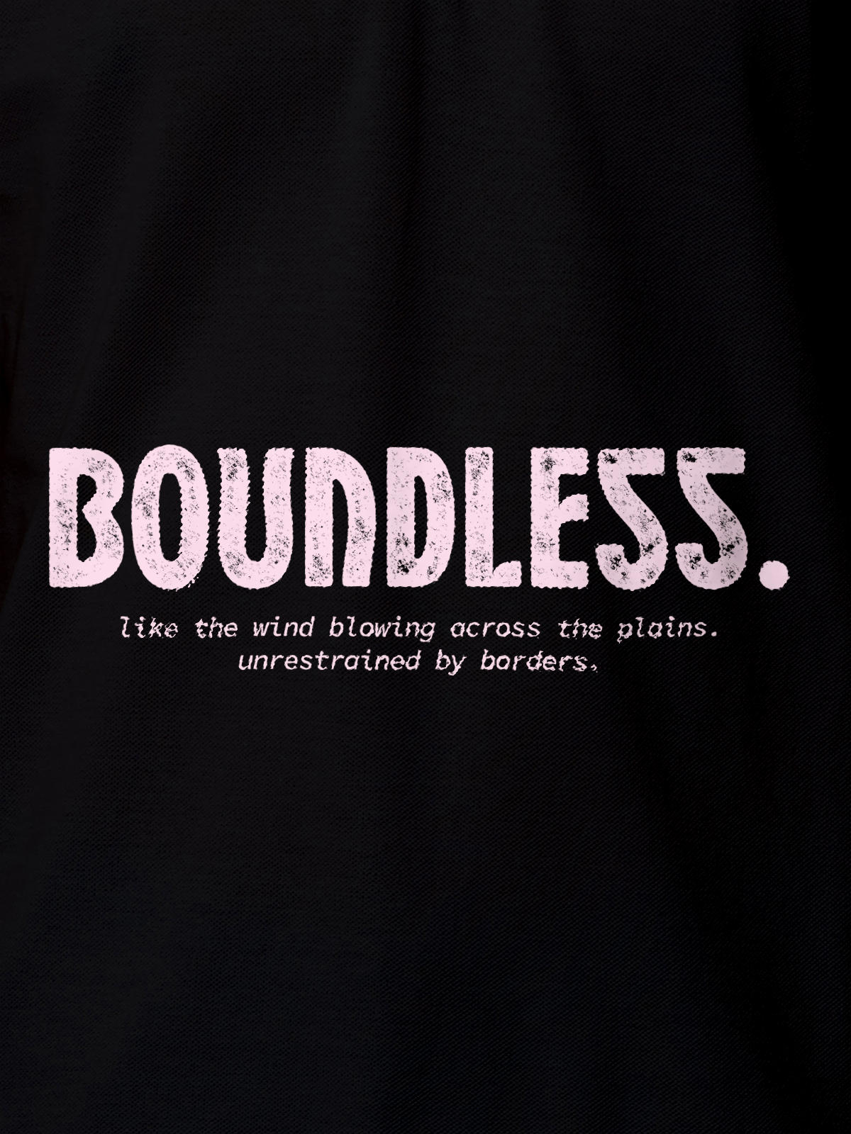 Close up of 'Free & Boundless' design on Men's Black Polo T-shirt, highlighting intricate details and vibrant print.