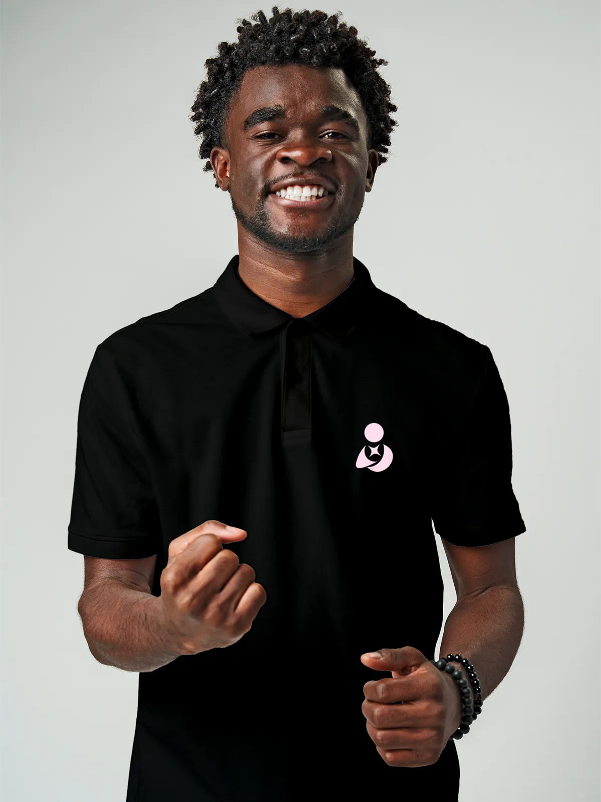 Close up of 'Free & Boundless' design on Men's Black Collar T-shirt, highlighting intricate details and vibrant print.