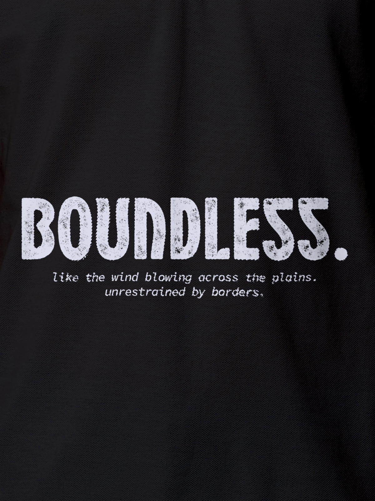 Close up of 'Free & Boundless' design on Men's Dark Grey Polo T-shirt, highlighting intricate details and vibrant print.