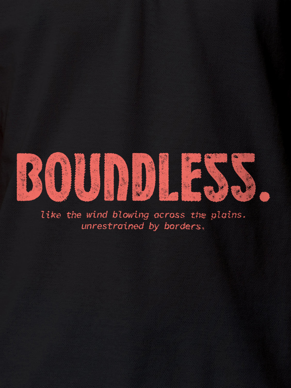 Close up of 'Free & Boundless' design on Men's Dark Grey Polo T-shirt, highlighting intricate details and vibrant print.