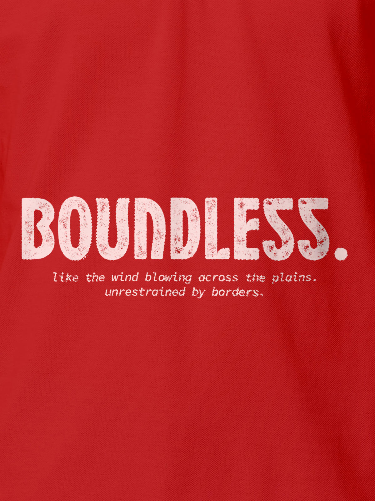 Close up of 'Free & Boundless' design on Men's Red Polo T-shirt, highlighting intricate details and vibrant print.