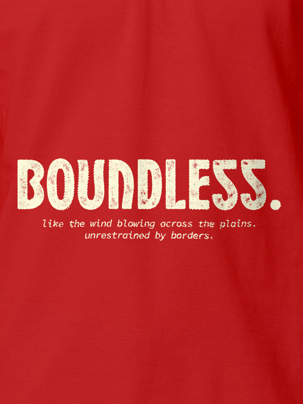 Close up of 'Free & Boundless' design on Men's Red Polo T-shirt, highlighting intricate details and vibrant print.
