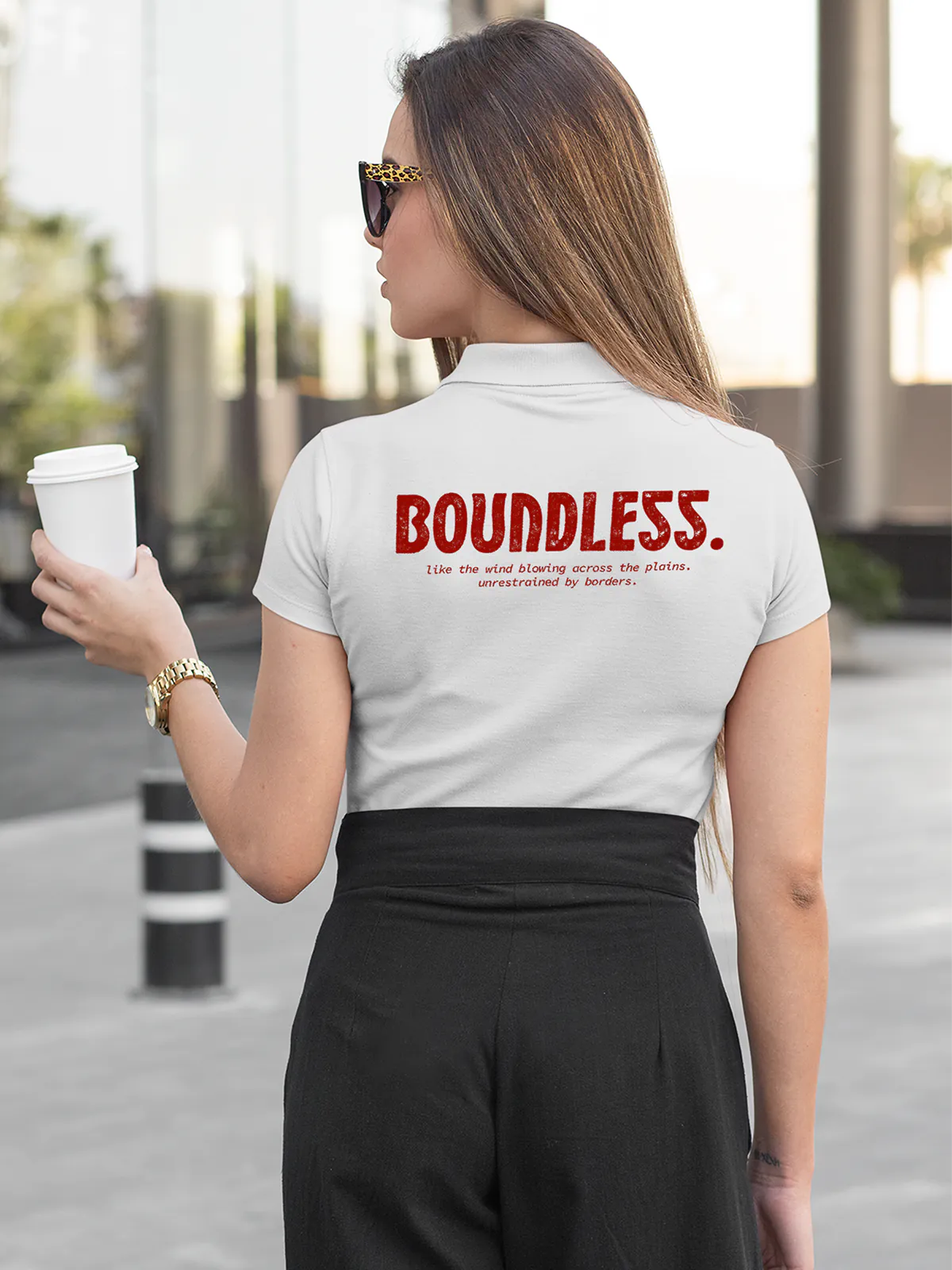 Fighterhero Polos: Model wearing Women's White Polo T-shirt with 'Free & Boundless' design