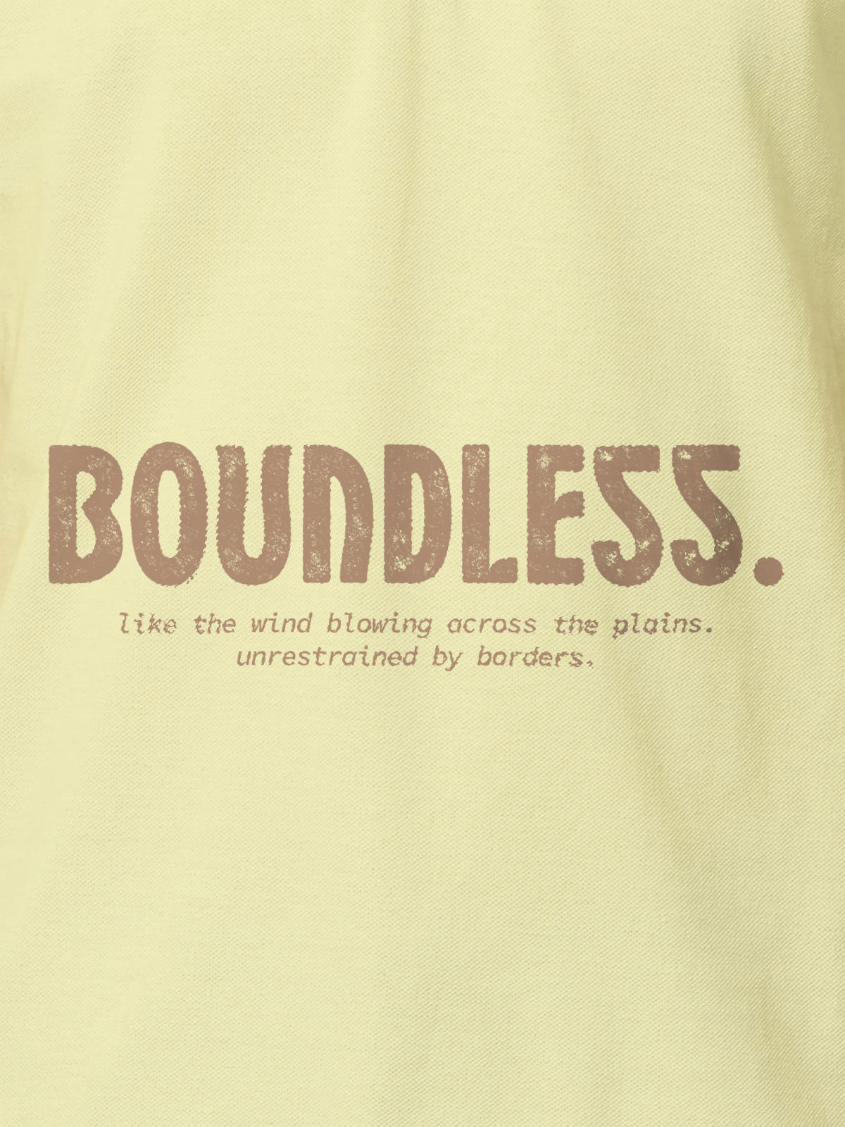 Close up of 'Free & Boundless' design on Men's Yellow Polo T-shirt, highlighting intricate details and vibrant print.